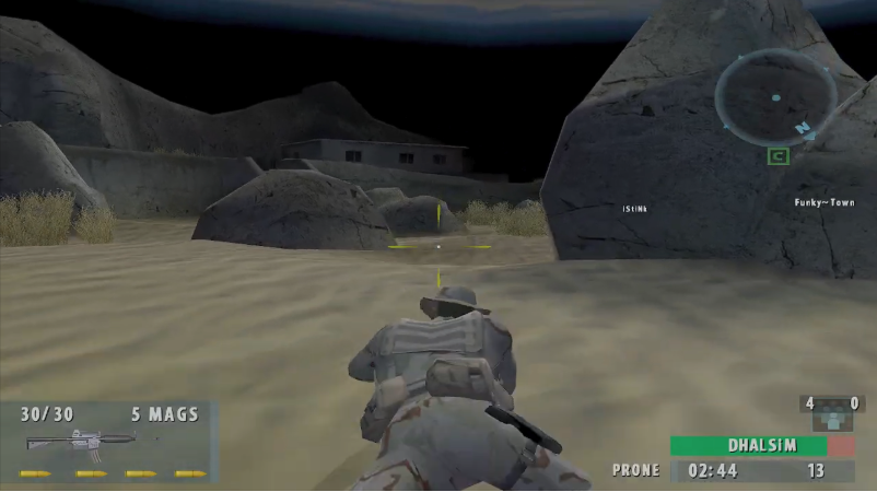 Original SOCOM II Night Stalker desert view with a house behind rocks and a large rock on the right.